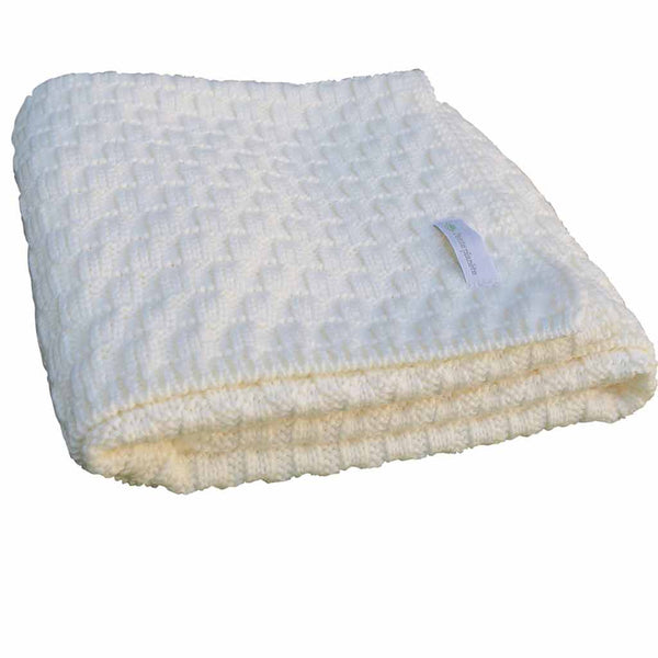 Une couverture bébé en laine 100% mérinos de la marque Petite Planète.